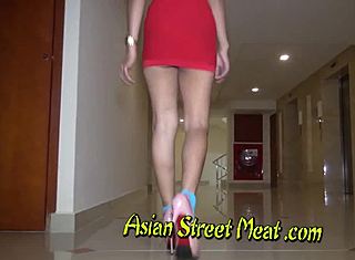 Asian teen in high heels gives a blowjob for money